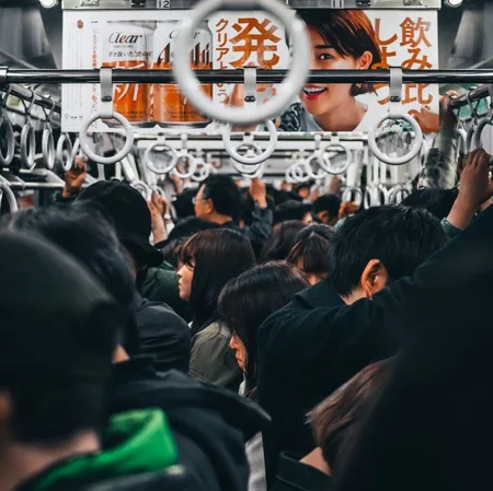 A busy subway car in japanese subway during rush hour
